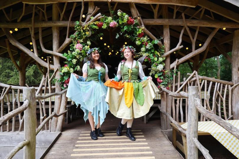 Cast members performing during a seasonal theatrical experience